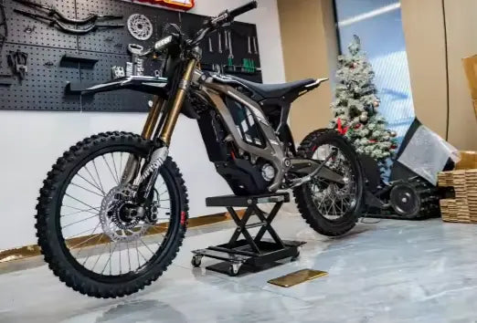 2026 Sur-Ron Light Bee LBX2 front quarter view displaying inverted front suspension forks and wheel setup.