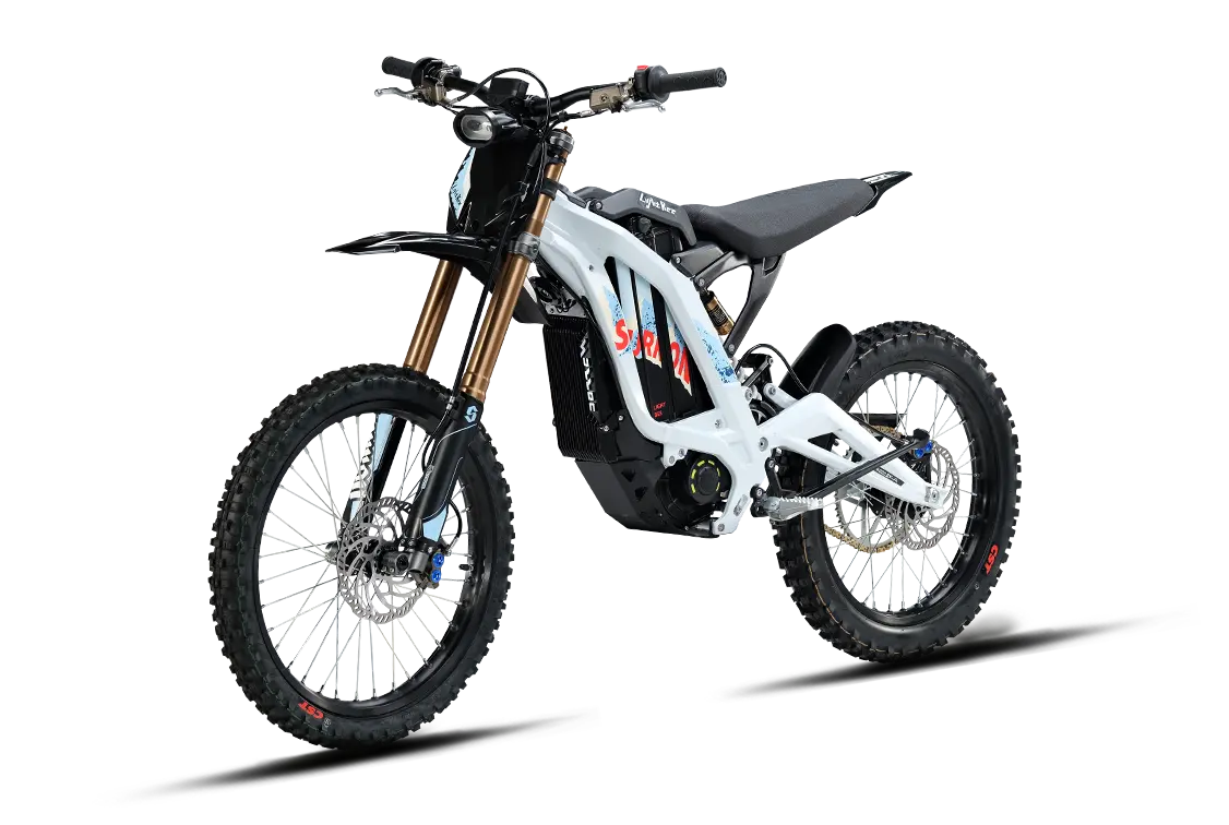 Silver, white, and blue edition 2026 Sur-Ron Light Bee X electric dirt bike three-quarters front view highlighting the 72V battery pack and forged frame.