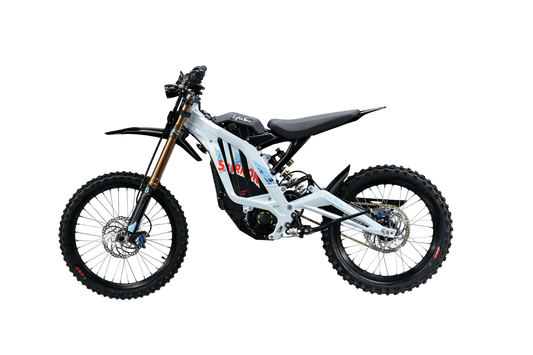 Side profile of white and silver 2026 Sur-Ron Light Bee X (72V 10kW) electric dirt bike highlighting mid-drive PMSM motor, lightweight aluminum frame, and rear chain drive.